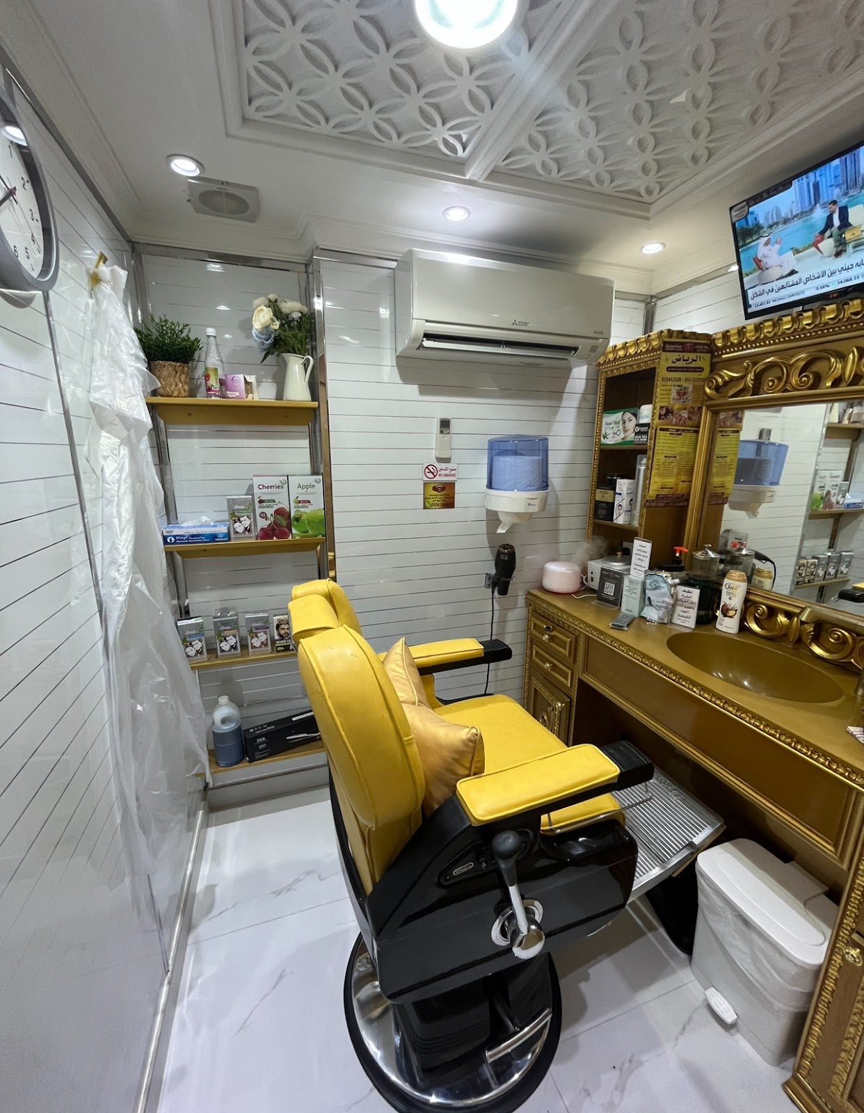 A private barber station with a yellow leather chair